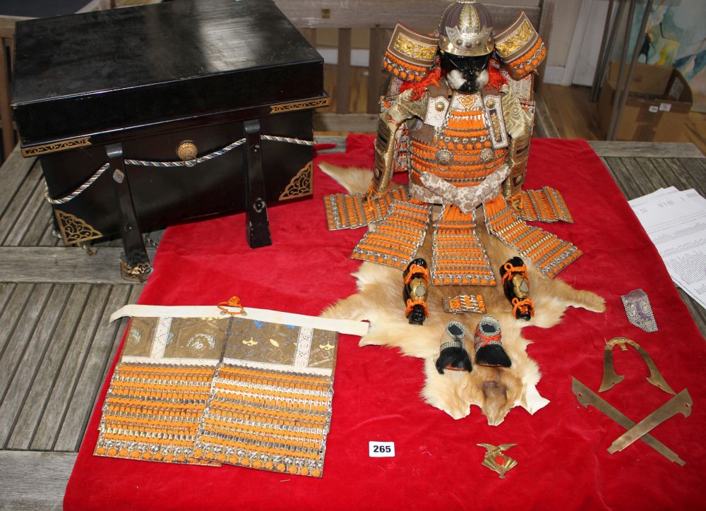 A Japanese late Meiji period suite of model Samurai armour, made from gilt and lacquered wood, braiding and thin metal, with partial di
